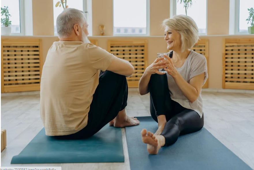 An older couple laughing and talking